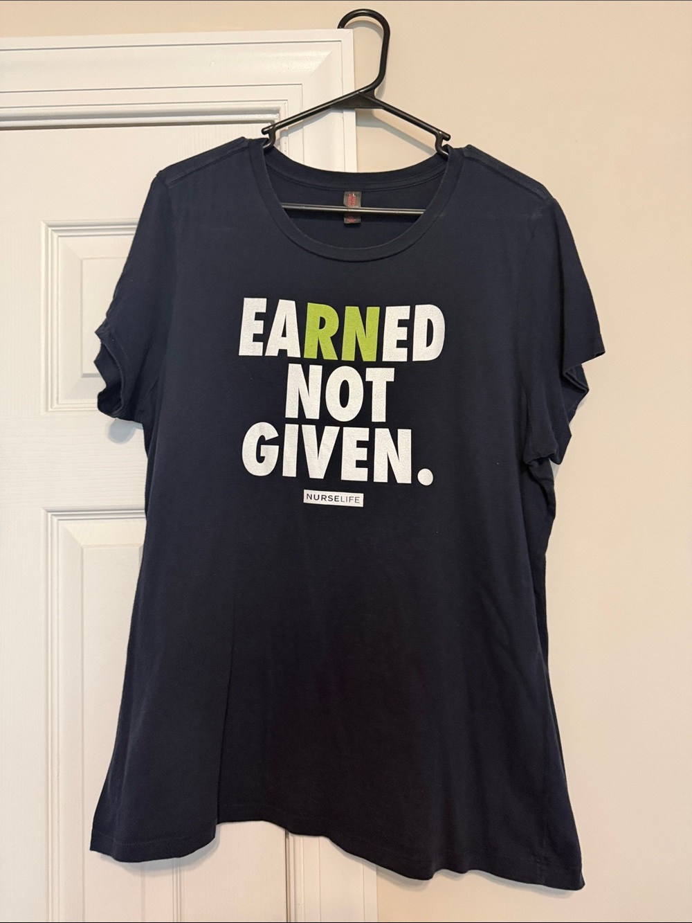 NURSELIFE Women's Navy 'Earned Not Given' Short Sleeve Tee